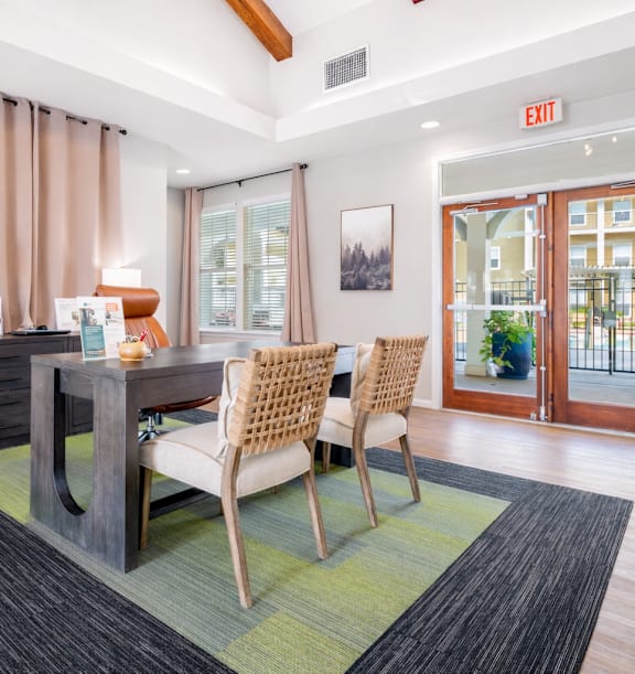 A large open space with a long table and chairs.