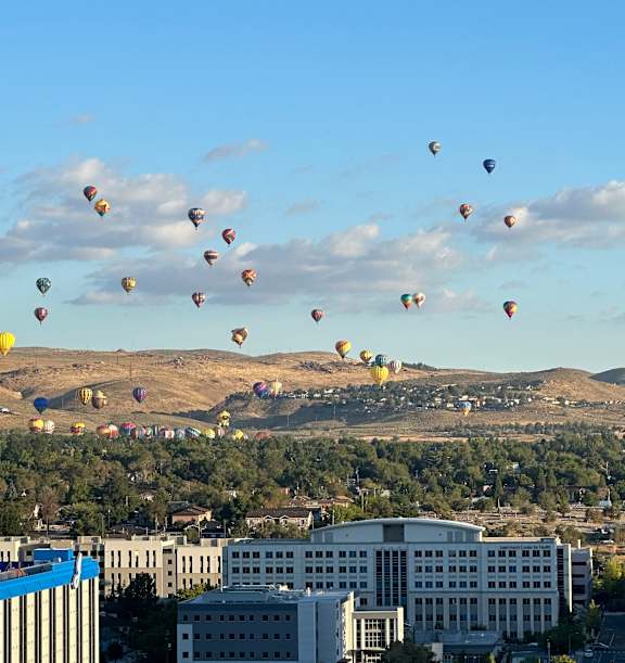 A row of townhouses with a sign that says at LSOP-Lakeside, LLC Apartments, Reno, NV