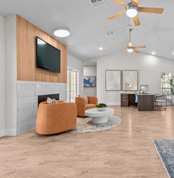 A living room with a television, a fireplace, and a ceiling fan.