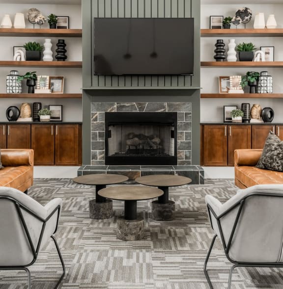 a living room with a fireplace and a tv above it