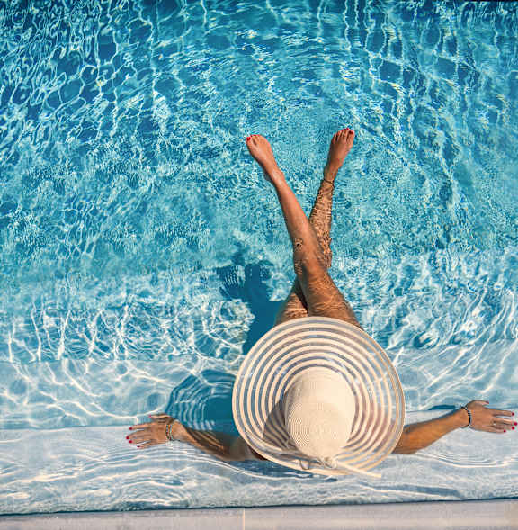 Woman wearing hat and floating in Pool at Artisan, Illinois, 62269