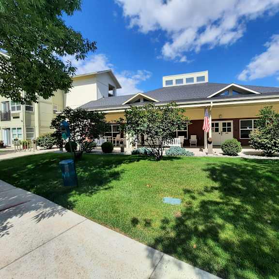 a large building with a lawn in front of it
