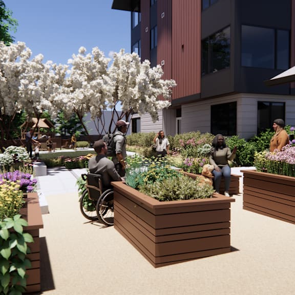 a group of people are sitting on a bench in a garden.