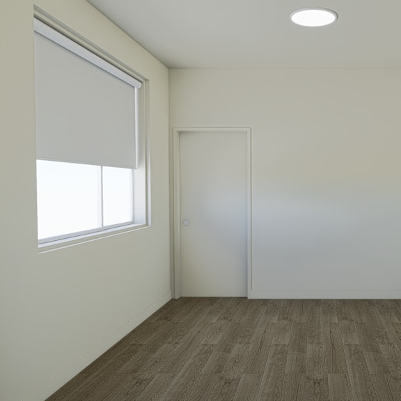 a room with a brown carpet and white walls.