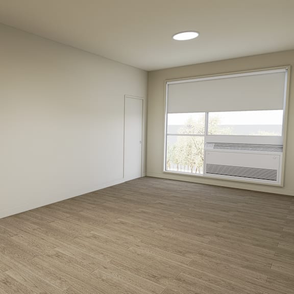 a room with a window and a staircase.