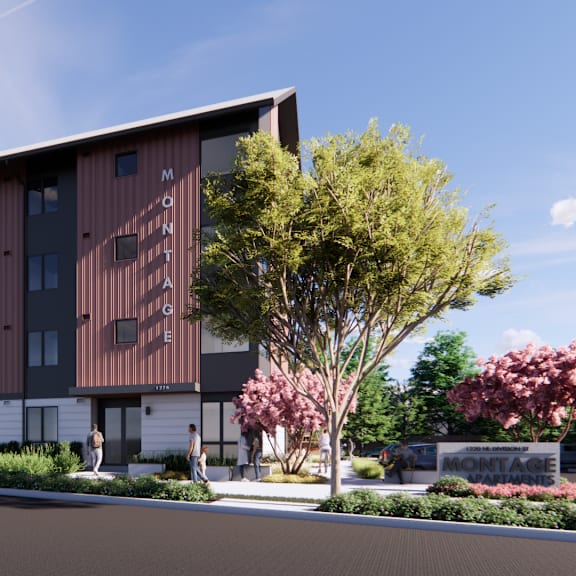 a modern building with a brown facade and a tree in front.