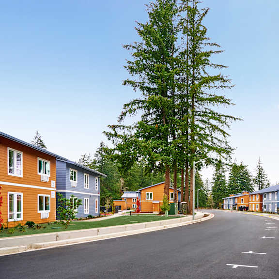 a row of houses on the side of a road