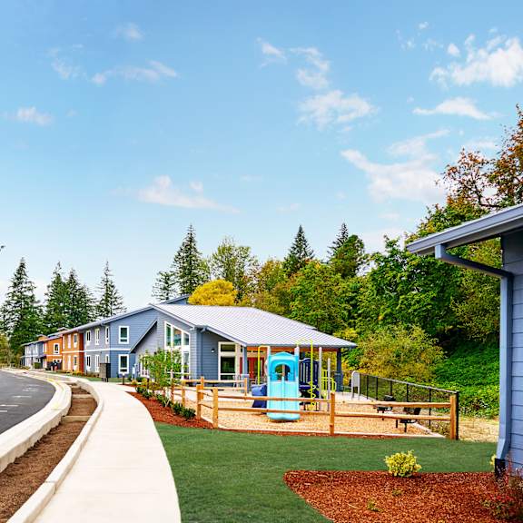 a row of houses on the side of a road