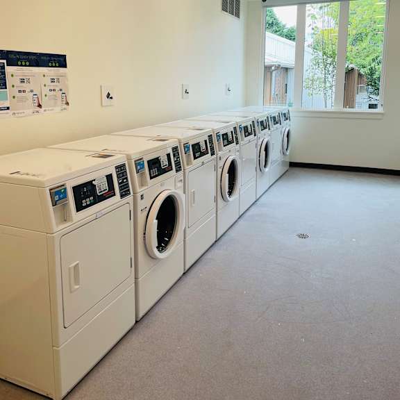 a view of the laundry room at the oxford at estonia apartments in san anton