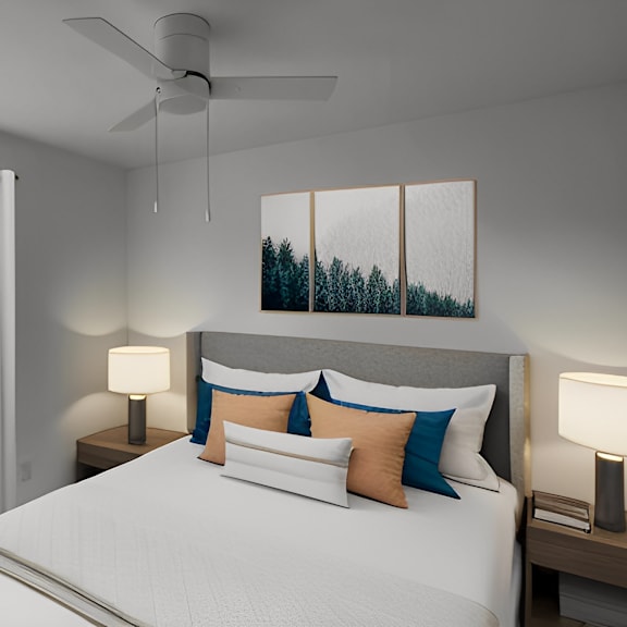 a bedroom with a large bed and a ceiling fan
