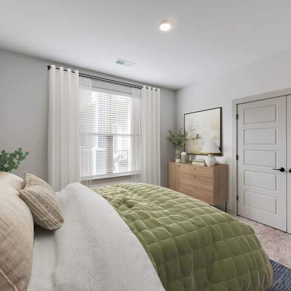 Thumbnail 16 of 21 A bedroom with a bed, nightstand, and wardrobe.