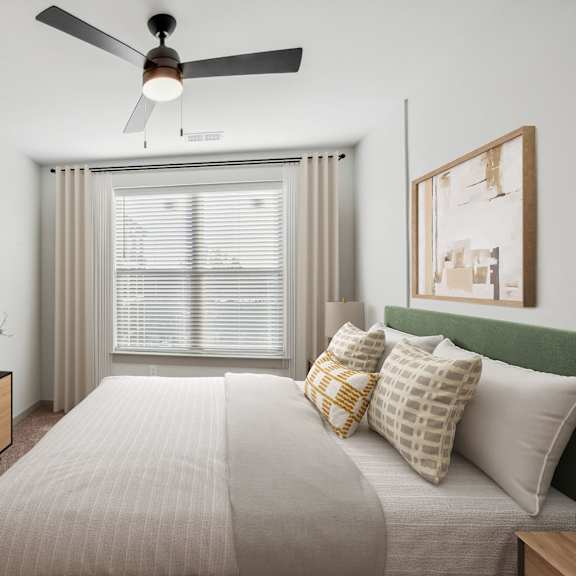 Thumbnail 9 of 10 A bedroom with a bed, nightstand, and a ceiling fan.