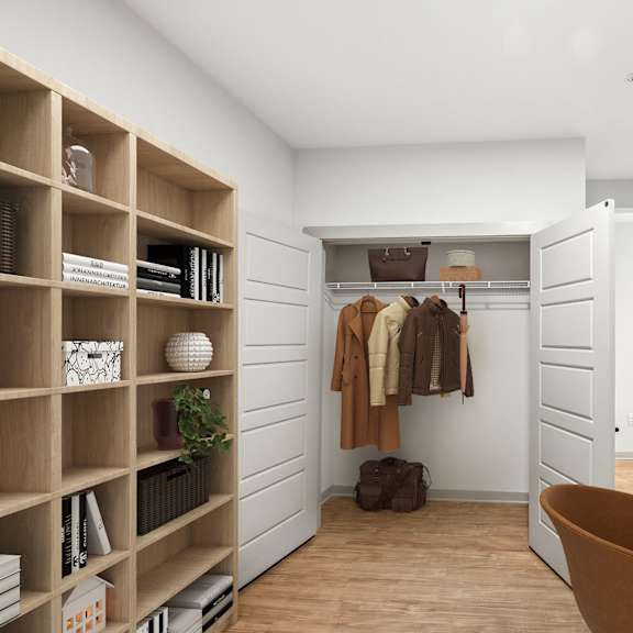 Thumbnail 7 of 10 A room with a wooden shelf, a chair, a desk, and a closet.