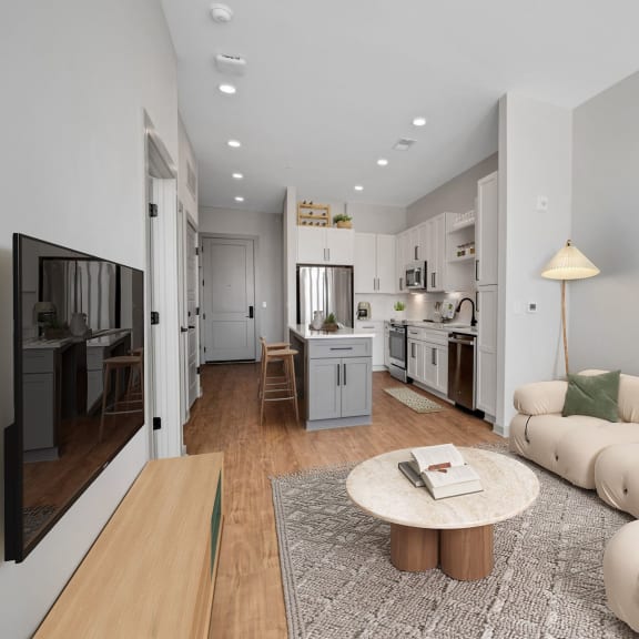 Thumbnail 6 of 6 a living room with a couch and a table  at Preston Ridge, Cary, NC, 27513