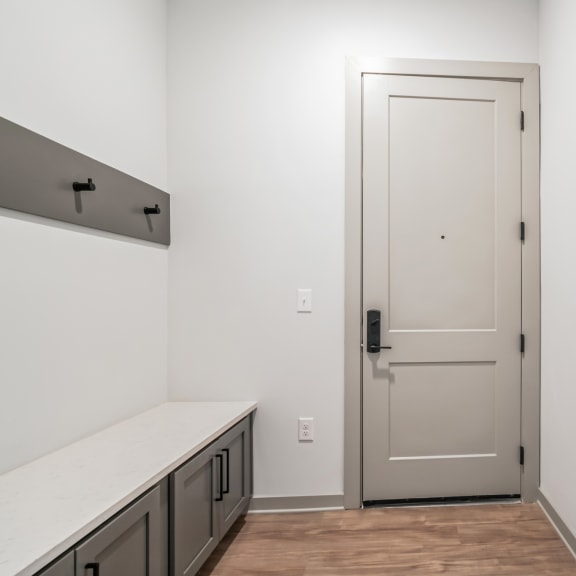 Thumbnail 3 of 21 a white room with a white door and a white counter top at Preston Ridge, North Carolina, 27513