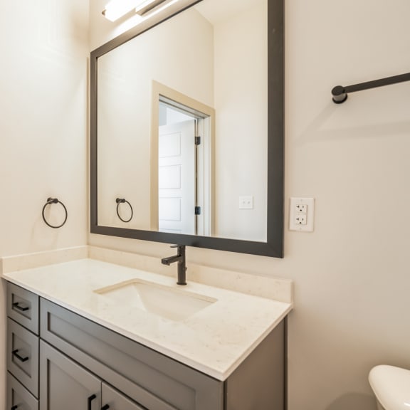 Thumbnail 11 of 21 a bathroom with a sink and a mirror at Preston Ridge, Cary