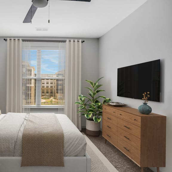 Thumbnail 9 of 12 a bedroom with a bed and a large window and a ceiling fan