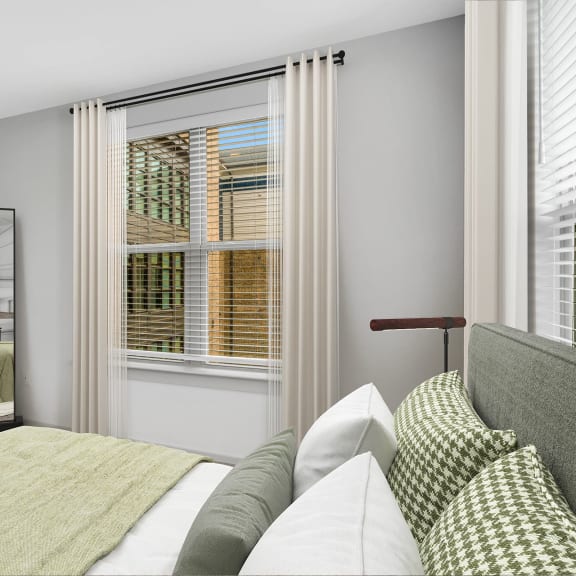 Thumbnail 6 of 12 a bedroom with a bed and a large window