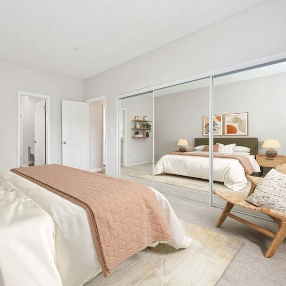 Thumbnail 11 of 17 A bedroom with a large bed and a chair.