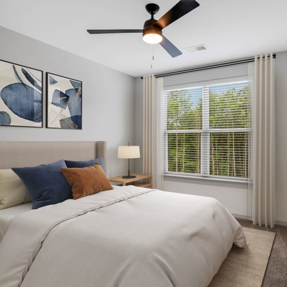 Thumbnail 6 of 9 bedroom with ceiling fan and window