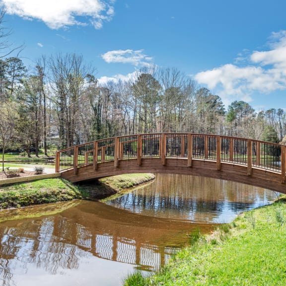 a dog park with agility rings and agility ropes at the whispering winds apartments in pearland, at Brampton Moors, Cary, NC