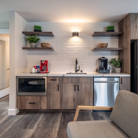 a kitchen with stainless steel appliances and a stainless steel refrigerator