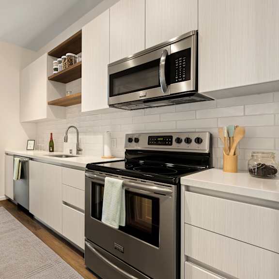 a kitchen with a sink stove and refrigerator