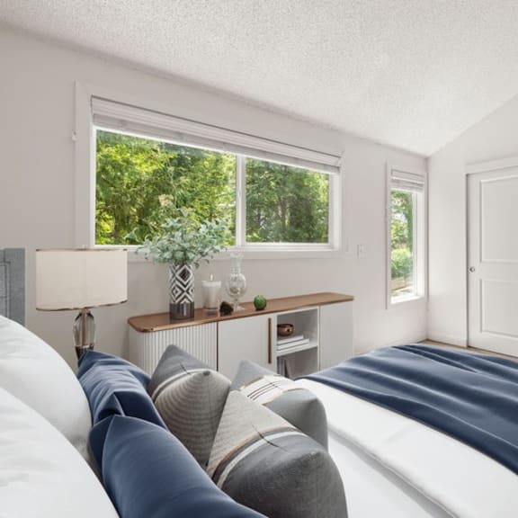 Bedroom with a large bed and a large window