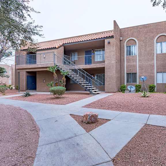 exterior building walking path at playa vista apartments, pacifica sd management, las vegas