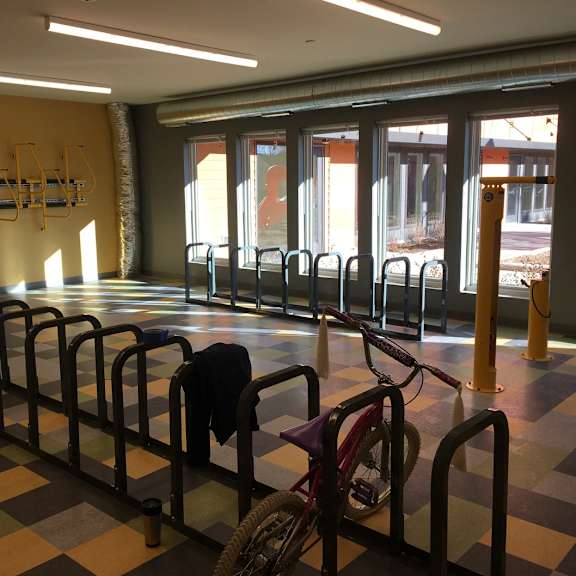 a bicycle is parked in a bike rack.