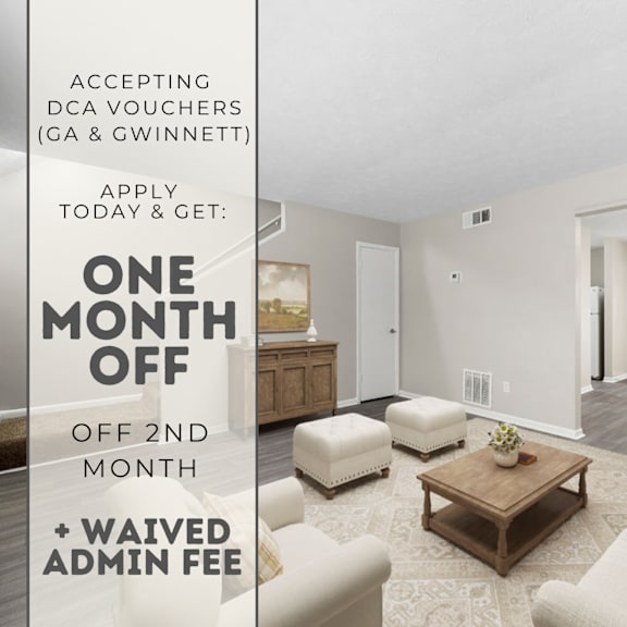 a room with a couch, ottoman, and coffee table is on sale for one month off.