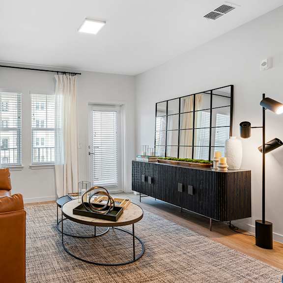 a living room with a couch and a table at madison waterford lakes, florida, 32826