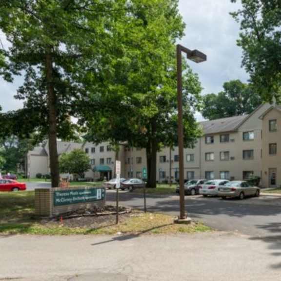a building with a parking lot in front of it.