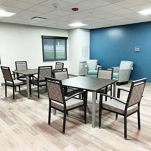 a conference room with a long table and chairs.