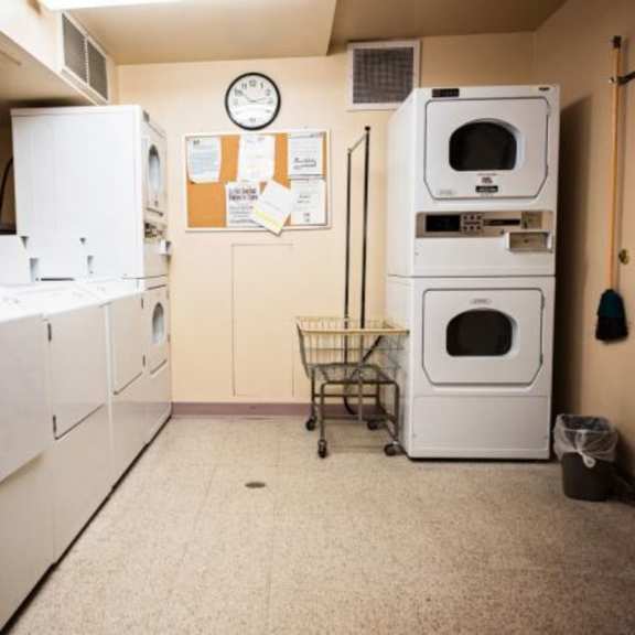 a laundry room with washers and dryers.