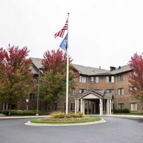 a building with a flag on top of a pole.