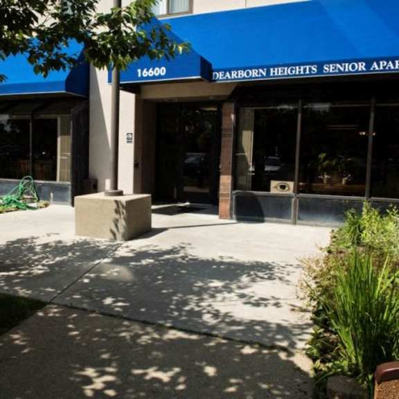 the front of the dearborn heights senior apartments building is shown.