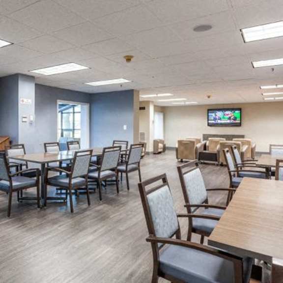 a conference room with a long table and chairs.