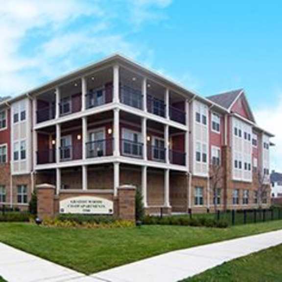 a large multi-story building with a sign in front that reads "chapman hall".