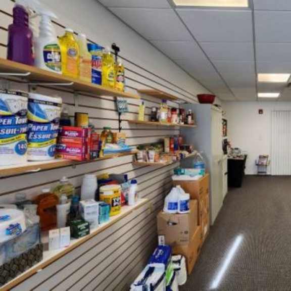 a room with shelves stocked with various products.