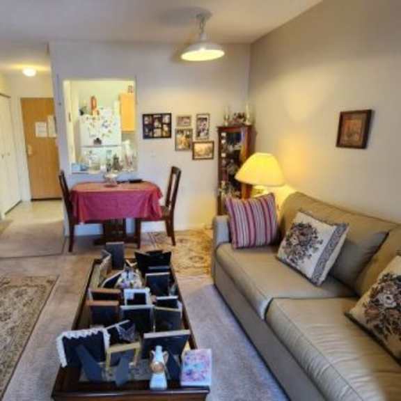 a living room with a couch, chair, and coffee table.