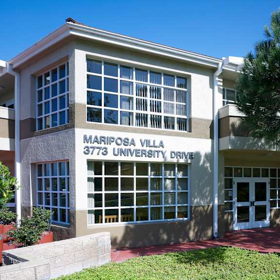 a building with the words mariposa villa on it.
