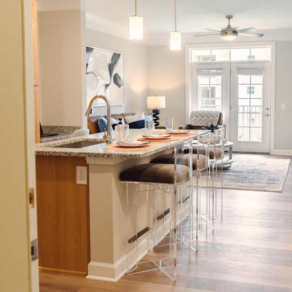 wood plank flooring in kitchen and living room