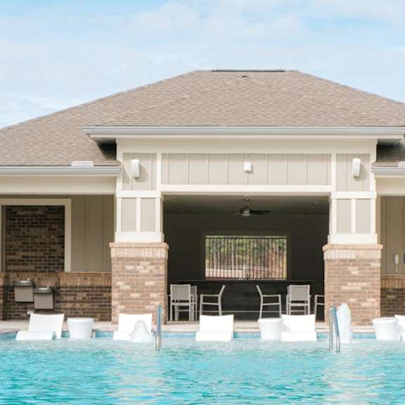 resort style pool with outdoor kitchen area