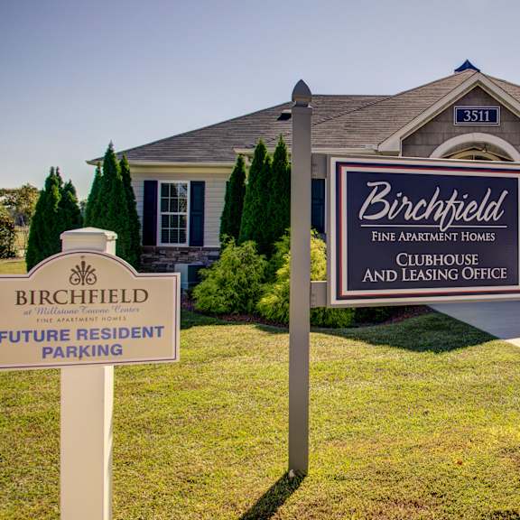 a sign for birchfield fine apartment homes and leasing office.