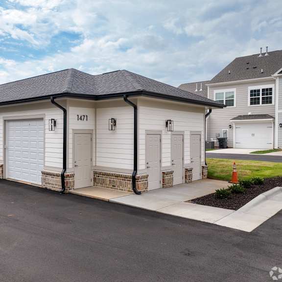 a row of garage doors are numbered 1471.