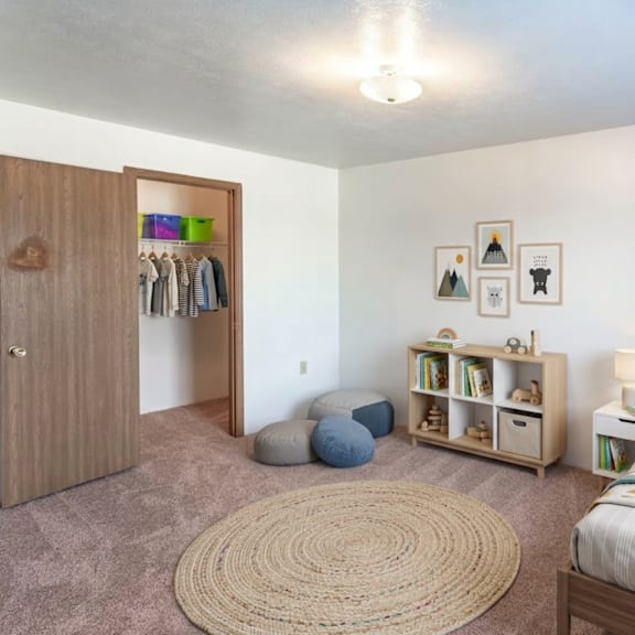 a bedroom with a bed, a wardrobe, and a rug.
