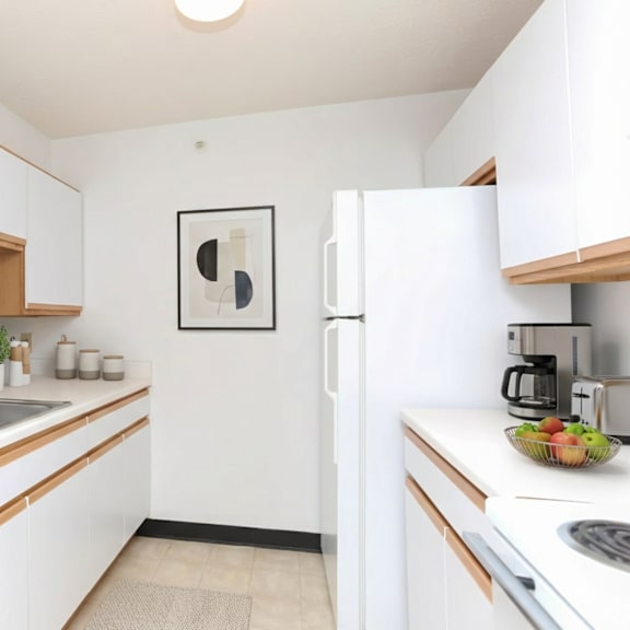 a modern kitchen with white cabinets and a wooden accent.
