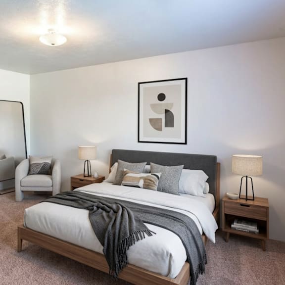 a bedroom with a large bed and a chair.
