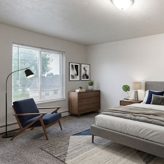 a bedroom with a large bed, a chair, and a nightstand.